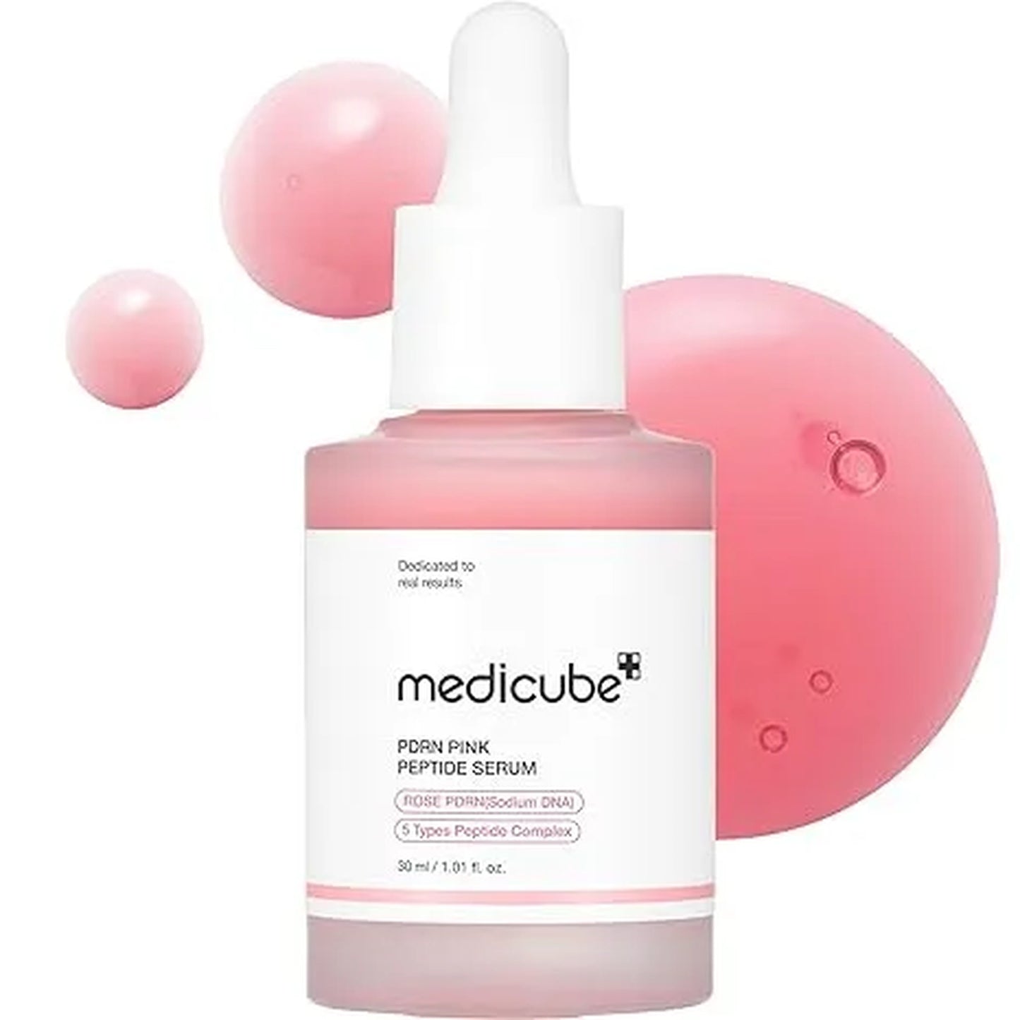 Medicube pink serum bottle with dropper on a white background