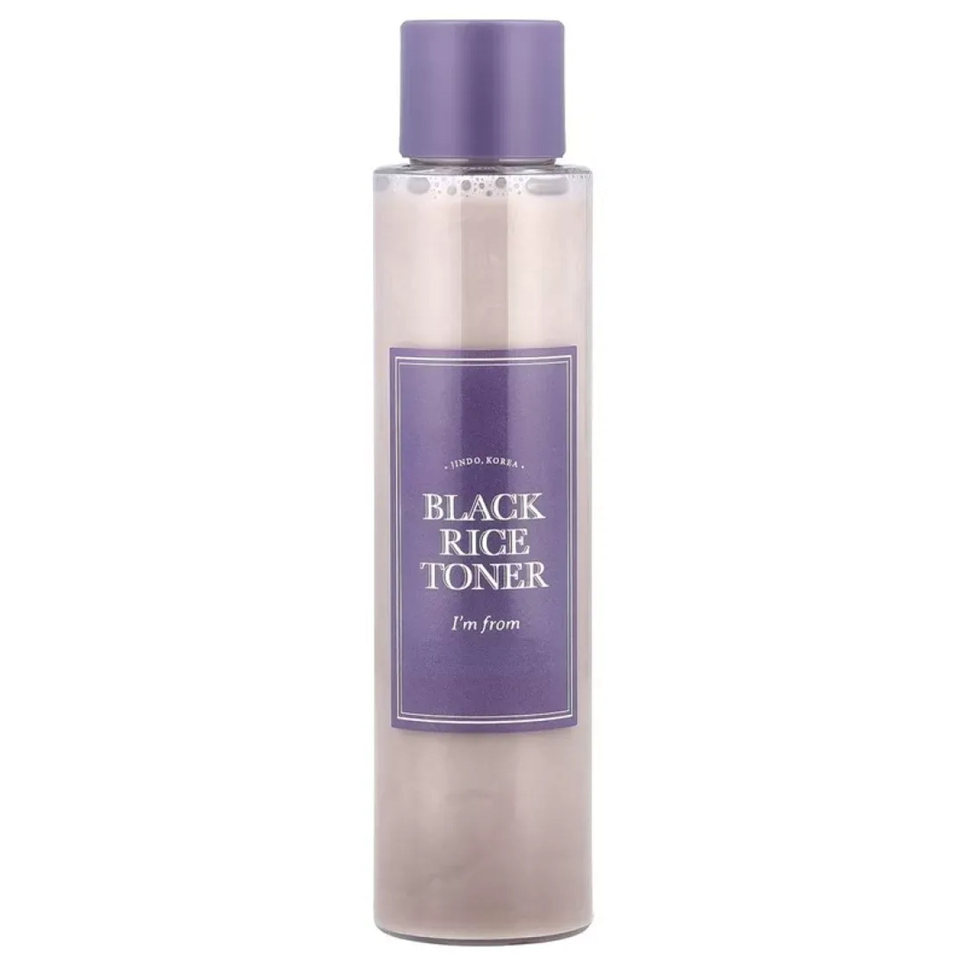 Bottle of black rice toner with a purple label on a white background